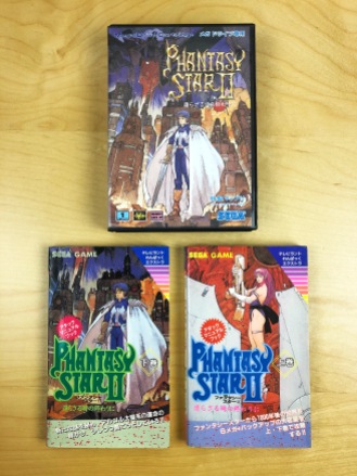 Phantasy Star II pictured with two hint guides.